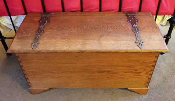 <p>Antique Arts & Crafts Cotswold School oak coffer with handmade hinges.</p>