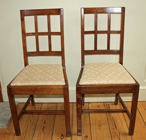 <p>Pair of good quality antique Arts & Crafts oak lattice back dining chairs by Heals.</p>