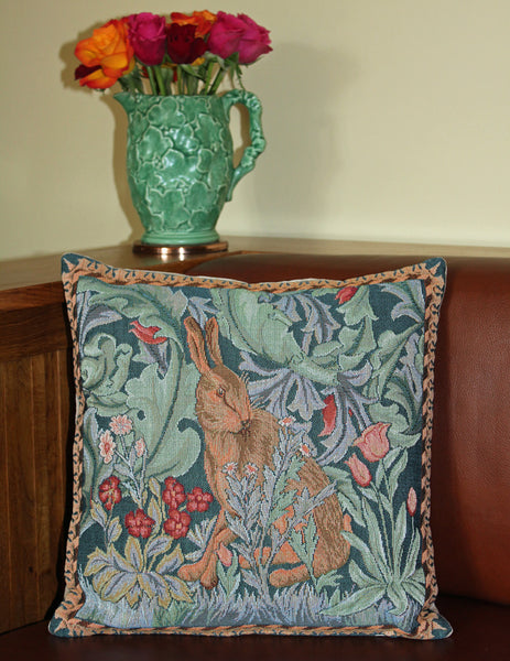 <p>Fine quality cotton jacquard woven tapestry cushion with beige velvet back in William Morris The Hare - facing right - design. Has a concealed zip fastener and removable feather pad.</p>