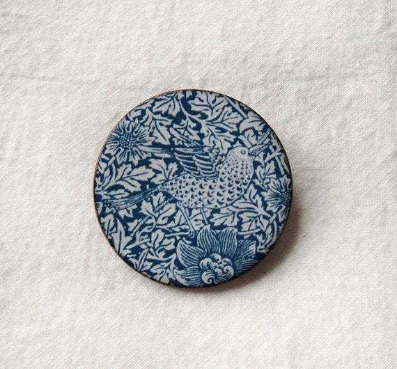 <p>Beautiful handmade ceramic brooch in the Bird & Anemone design by William Morris.</p>