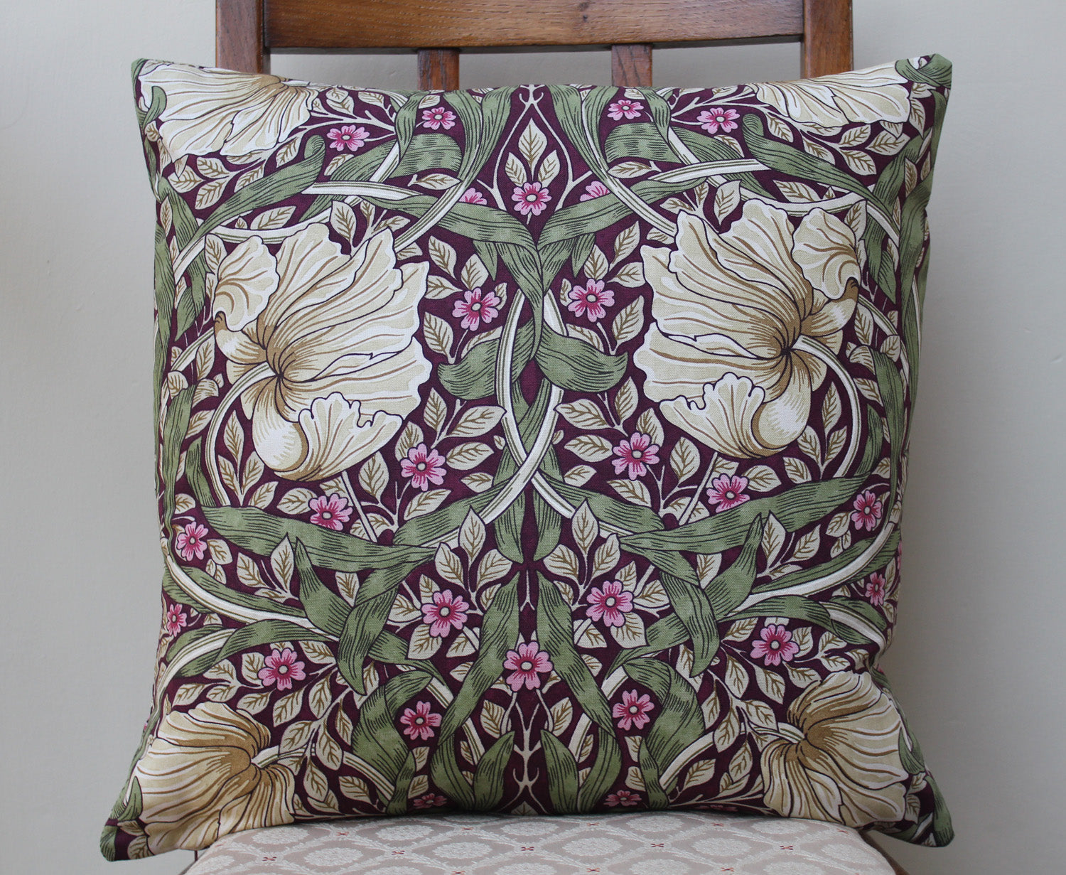 <p>Cotton filled cushion in William Morris Pimpernel Aubergine print made from Morris & Co. Sanderson fabric.</p>